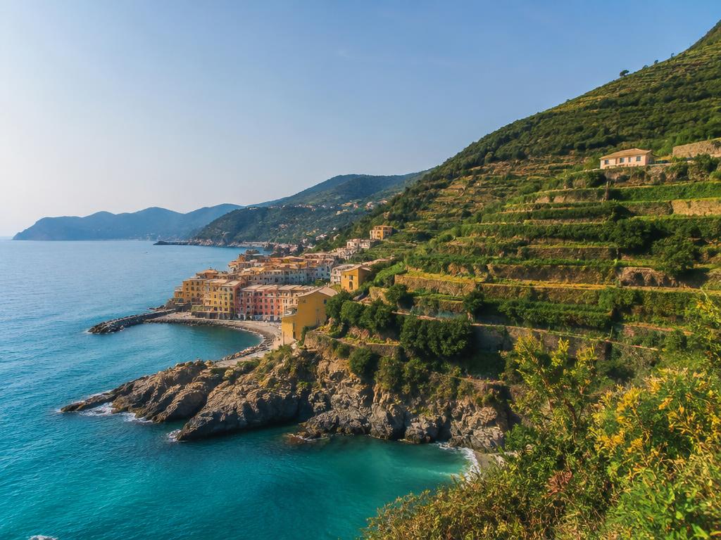 Colourful coastal village above a turquoise sea